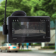 The Garmin Dash Cam Live attached to a windshield recording what the driver sees of the road ahead.